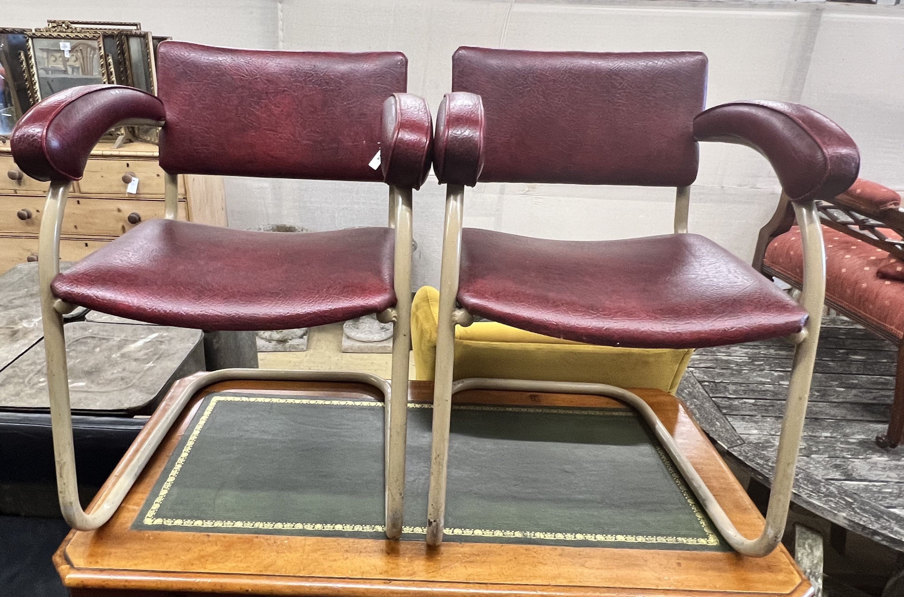 A pair of Pell elbow chairs, width 56cm depth 44cm height 78cm
